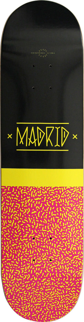 Madrid Disease 8 skateboard deck: A black upper half with the Madrid logo in yellow hand-drawn capitals between crosses, over a yellow band and a pink lower half covered in yellow squiggle shapes.
