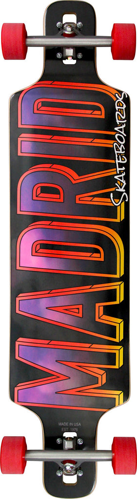 Madrid Dtf 41 skateboard deck: Drop-through longboard shown with red wheels and silver trucks. Huge 'MADRID' capital lettering fills the deck with an orange to yellow outline and a purple-pink cloudy fill on black, with 'Skateboards' in white script.