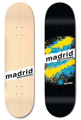 Madrid Explosion Black 7.75 skateboard deck: Yellow and blue paint splatter in a circle on black, crossed by a torn white strip with madrid skateboards lettering. The natural wood underside carries the same strip logo.