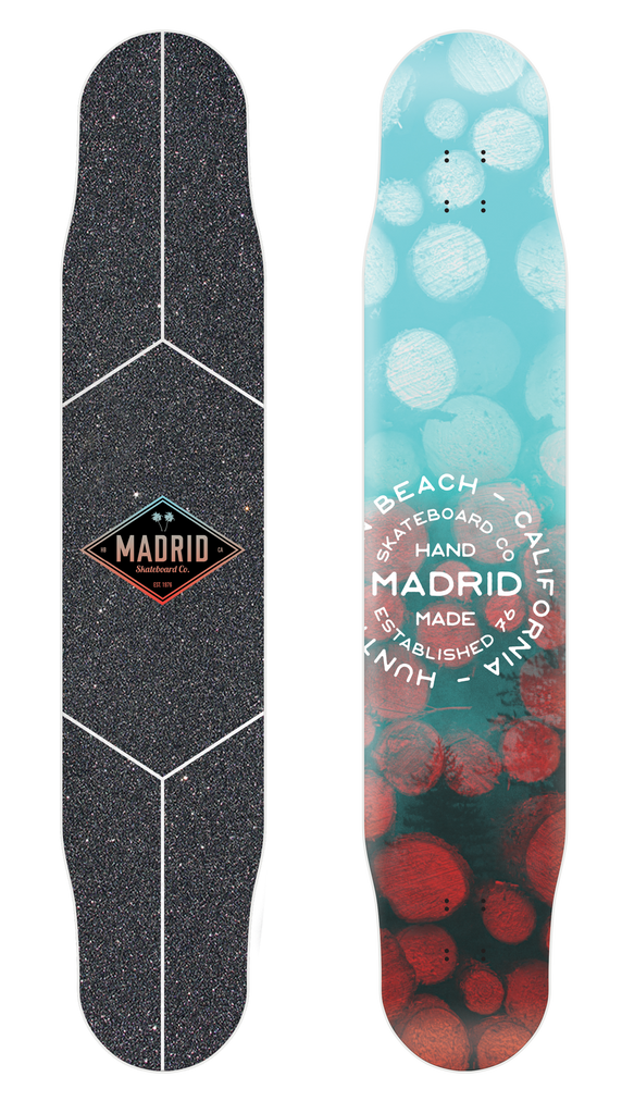 Full Circle Distribution Fiberglass Pole 46 skateboard deck: Long dancer-style longboard. Top has black grip with white outline panels and a diamond Madrid logo. Underside has blurred teal and coral bokeh circles with a circular Madrid Huntington Beach, California hand made stamp.
