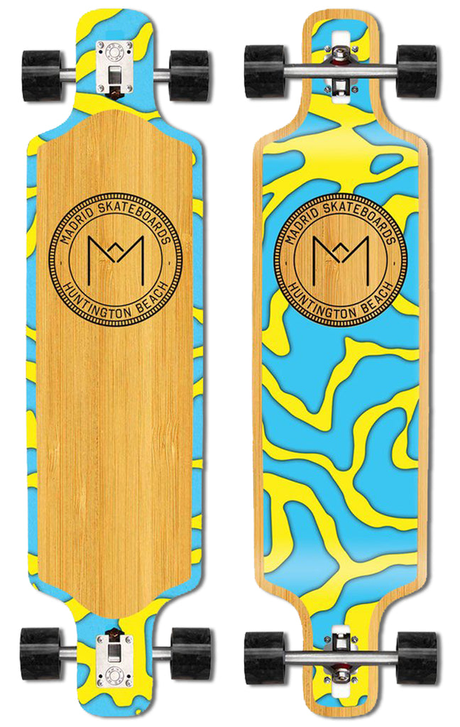 Madrid Harbor Series DTF 39 skateboard deck: Drop-through longboard complete with black wheels, with a bamboo veneer centre and swirling topographic-style blobs of cyan and yellow around the edges and underside. A circular Madrid Skateboards, Huntington Beach logo with an M mark sits centrally.