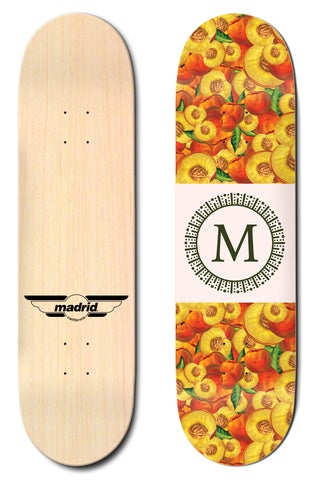 Madrid Peaches 8.25 skateboard deck: Deck covered in illustrated sliced and whole peaches in yellow, orange and red with green leaves. A cream band across the middle holds a green letter M inside a circular ornamental ring. Plain natural underside with Madrid wing logo.