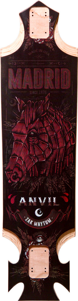 Madrid Pro Series Anvil 37.4 skateboard deck: Drop-through longboard with a dark ground and a large red engraved horse's head, ornamental foliage and an eye motif. Madrid logo with 'Made in USA, since 1975' at the top and 'Anvil - Zak Maytum' lower down.