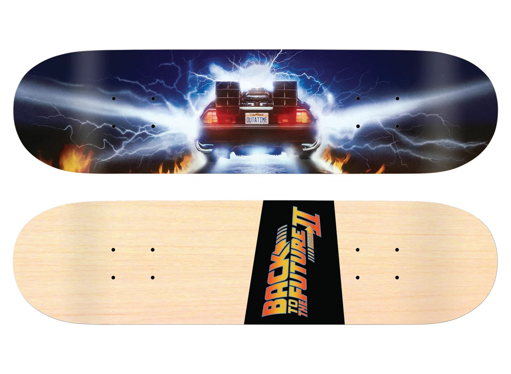 Madrid X Back to the Future - Burnout 8 skateboard deck: Rear view of the DeLorean time machine with glowing red lights and a licence plate, surrounded by blue-white lightning and flames on the road. The natural wood underside has a Back to the Future Part II logo.