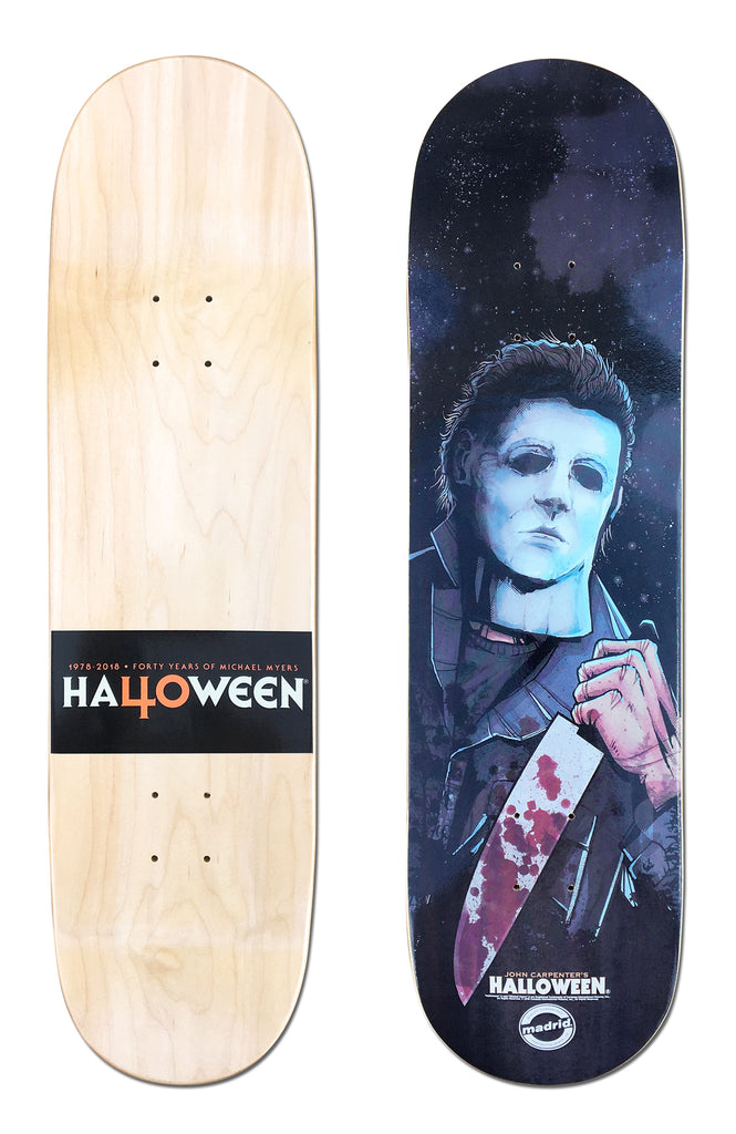 Madrid X Halloween - Boogeyman 8 skateboard deck: Illustrated portrait of a figure in a pale expressionless mask and dark coveralls holding a bloody kitchen knife, against a dark starry blue night. Underside has a black band reading Halloween 40 years.