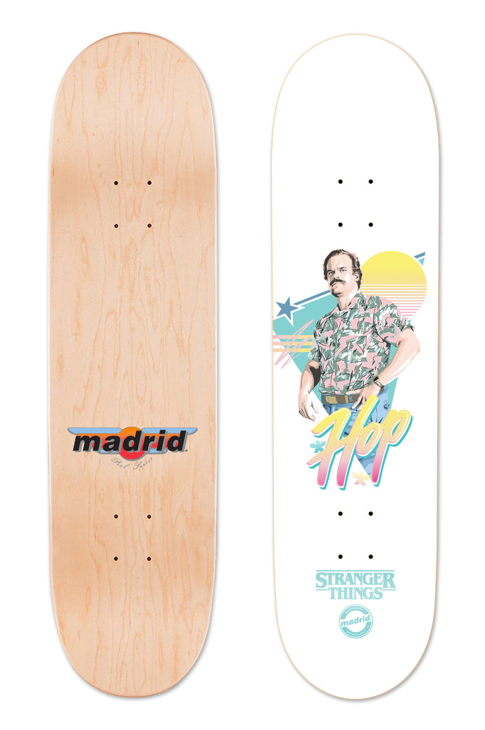 Madrid X Stranger Things 3 - Hop 8 skateboard deck: Retro 1980s-style illustration of a moustached man in a floral shirt against a pastel sunset and star, with pink and yellow script. Stranger Things logo at the base; underside has the Madrid logo on bare wood.