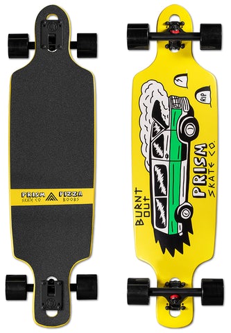 Prism Skate Co. Prism Skewer 34.5 skateboard deck: Yellow drop-through longboard with a hand-drawn green and white station wagon trailing smoke, with ghost and RIP headstone doodles. Prism Skate Co. text and BURNT OUT on the graphic. Complete with black trucks and wheels, grip view alongside.