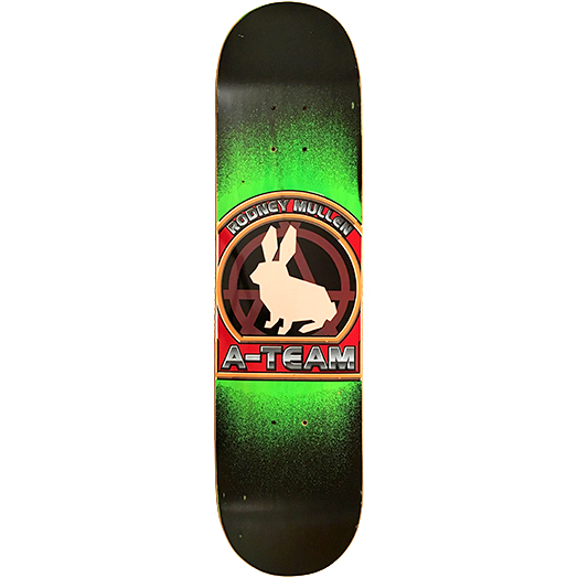 A-Team Rodney Mullen Crest skateboard deck: Round crest showing a cream rabbit silhouette over a dark anarchy-style A symbol, framed in red and orange with chrome lettering. Set on a black deck with a bright green airbrushed glow.