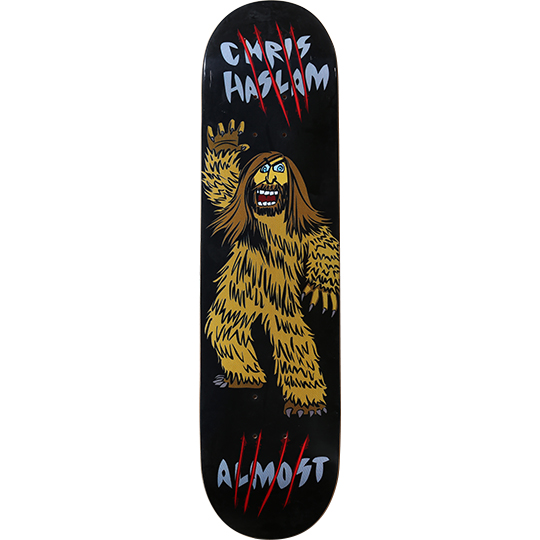 Almost Chris Haslam Hasquatch skateboard deck: A cartoon bigfoot-style creature with a bearded, long-haired human face waves one hand, drawn in bold outlines on a black deck. Red claw slashes cut through the grey rider name at the top and brand name at the bottom.