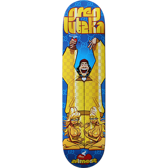Almost Greg Lutzka Gucci Suit skateboard deck: Cartoon of a laughing man in a yellow tracksuit, arms raised with a drink, over a blue deck with a repeating monogram pattern. Two blonde cartoon women sit cross-legged below, and the name Greg Lutzka is in yellow lettering at the top.
