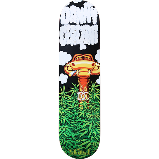 Blind Danny Cerezini Snake in the Grass skateboard deck: A cartoon cobra with a joint in its mouth and a gold chain pendant rises from a field of cannabis leaves, with white bubble-letter Danny Cerezini lettering formed from smoke clouds above. Blind logo at the tail.