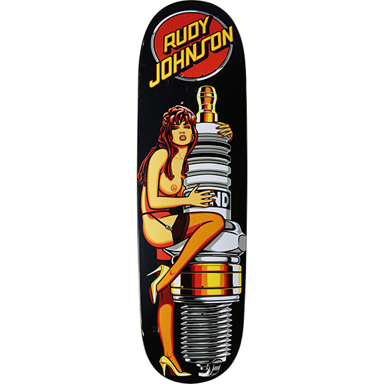 Blind Rudy Johnson Sparkplug Girl (silkscreen reissue) skateboard deck: A topless pin-up woman in stockings and heels sits hugging a giant chrome spark plug, in a retro illustrated style on black. Rudy Johnson in yellow lettering over a red circle at the top.