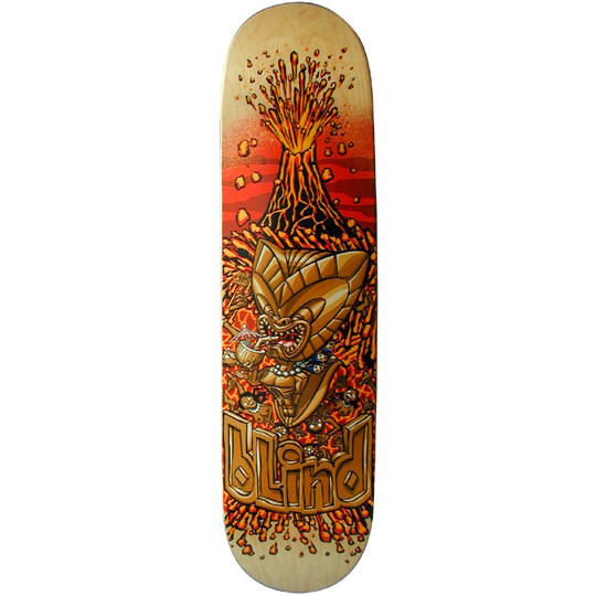 Blind Tiki skateboard deck: Golden tiki idol sipping a tropical cocktail in front of an erupting volcano, surrounded by lava and small skulls, on a natural wood deck with red-orange background. Blind logo in carved gold lettering at the bottom.