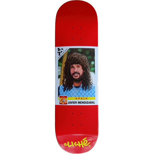 Cliché Javier Mendizabal World Cup Series skateboard deck: Red deck with a football sticker-card style portrait of a bearded man with a big curly wig and blue top, with Spain flag crest, World Cup 2014 ball logo and name caption. Brand logo in yellow below.