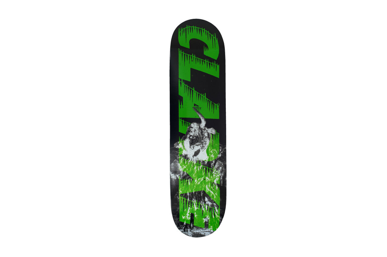 Palace Bankhead Clark Board skateboard deck: Large dripping green lettering reading 'CLARKE' running up the deck over a black and white photo of a figure with horns, on a black deck.