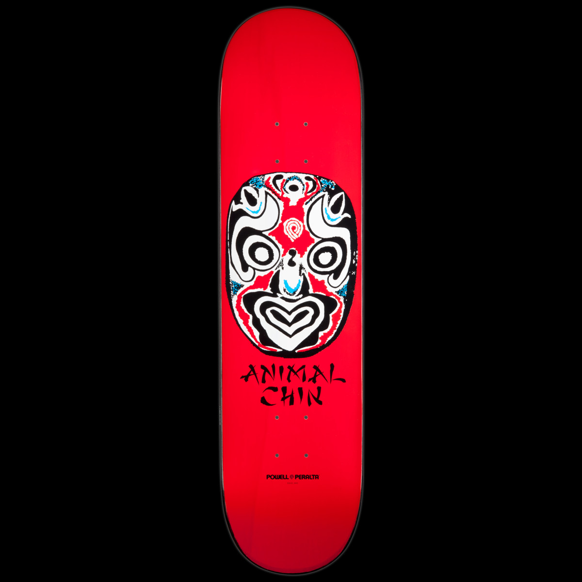 Powell Peralta LIGAMENT Chin Mask Red skateboard deck: A white, black and red opera-style face mask with blue accents, above ANIMAL CHIN in brush lettering, on a bright red deck. Powell Peralta logo near the tail.