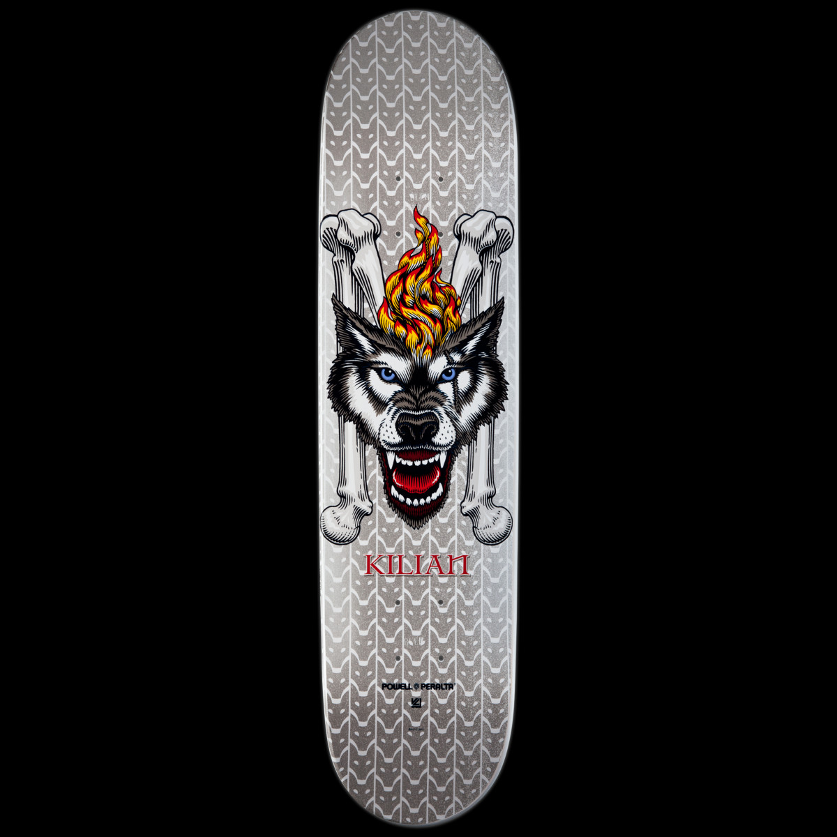 Powell Peralta LIGAMENT Pro Kilian Martin Wolf 2 skateboard deck: Snarling wolf head with blue eyes and a flame on its brow, set against two crossed bones, on a silver deck with a repeating chain-like pattern. The rider's name is in red below.
