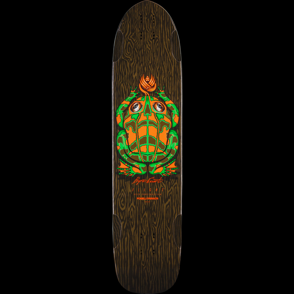 Powell Peralta Pro Byron Essert Mini Frog Flight - Shape 306 skateboard deck: A green and orange frog with a skull-like pattern on its back sits in the centre of a dark brown woodgrain-textured deck, with a flame-like tuft above. Signature and Flight text below.