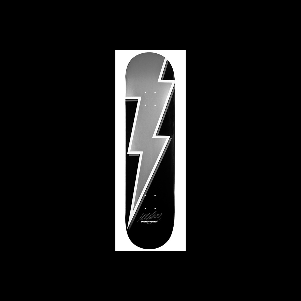 Powell Peralta Pro Mike Vallely Original Lightning Bolt skateboard deck: A large silver lightning bolt with a white outline runs the length of a black deck. A small signature and Powell Peralta logo sit near the tail.
