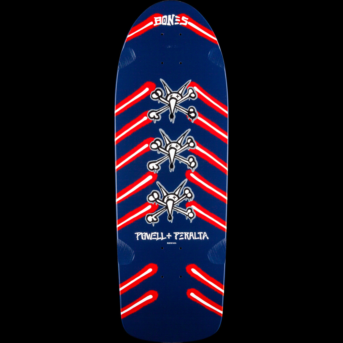 Powell Peralta Rat Bones Blem Navy skateboard deck: Three stacked Rat Bones skull-and-bones logos run down the centre of a navy old-school deck, flanked by red and white chevron-shaped stripes. Bones lettering sits at the nose and Powell Peralta text near the tail.