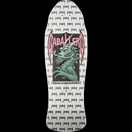 Powell Peralta Steve Caballero Street White skateboard deck: A green dragon with horns and pink eyes rises from a black maze-patterned panel framed by pink bat wings, on a white deck covered with repeating grey bat logos. The rider name arches across the top.