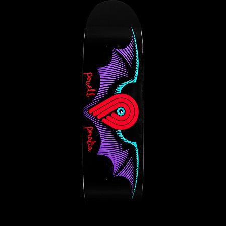 Powell Peralta Winged P Black skateboard deck: Black deck with the red Powell P logo with a cyan eye, set between large purple bat-like wings edged in cyan. The name is written in red script down both sides of the logo.