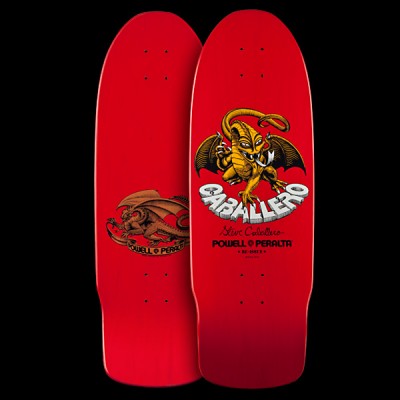 Powell Peralta Caballero Dragon II - Red skateboard deck: A golden winged dragon with a curled tail clutches a banner, with the name in large white 3D lettering beneath it on a red deck. Signature and brand text sit below, and the underside shows a brown dragon.