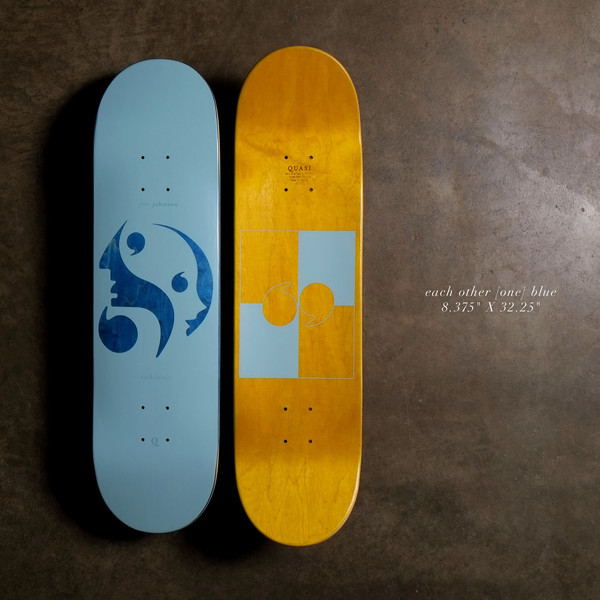 Quasi Each Other - Blue skateboard deck: Pale blue deck with a deep blue graphic of two abstract face profiles whose forms make a comma and speech-mark shapes. The underside has a yellow-stained wood finish with a blue geometric panel.