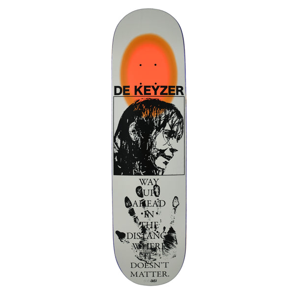 Quasi de Keyzer Distance skateboard deck: Grey deck with a blurred orange glow at the nose, a framed black print-style portrait of a woman with dark hair, and a black handprint below with a serif quote reading Way up ahead in the distance where it doesn't matter.