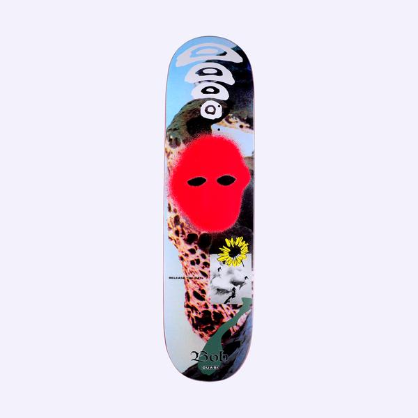 Quasi de Keyzer Iowa skateboard deck: Collage of a blue sky and pitted rock face, with a red spray-painted blob with eye holes like a mask. A grey stacked circle motif sits at the top, a yellow sunflower and small photo inset below, and Bob in gothic script at the foot.
