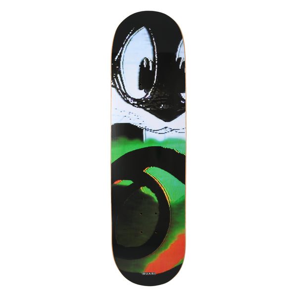 Quasi Scrambled skateboard deck: Distorted, glitchy cropped image of a cartoon cat's big eyes and face above green, black and orange swirling shapes, in the manner of a scrambled TV signal. Small Quasi label at the tail.