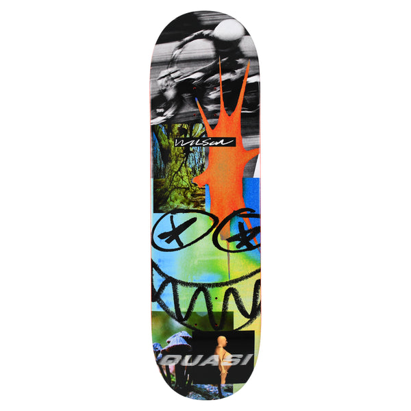 Quasi Wilson Big Data skateboard deck: Collage of photo fragments and graphics: a blurred monochrome cyclist, forest, mushrooms and a bald figure, overlaid with a black scrawled grinning face with crossed eyes and an orange splash. Rider and brand names are in small lettering.