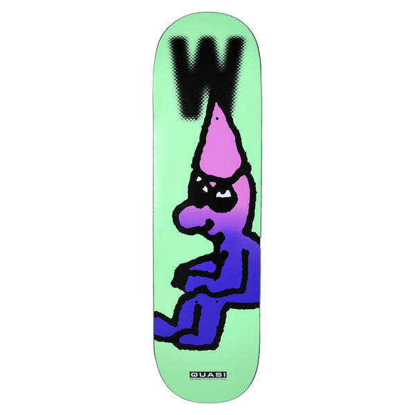 Quasi Wilson The Sitter skateboard deck: Chunky black-outlined cartoon of a seated pink and purple gradient figure in a pointed hat with a scowling face, under a large blurred black 'W', on a mint green deck. Quasi label at the bottom.