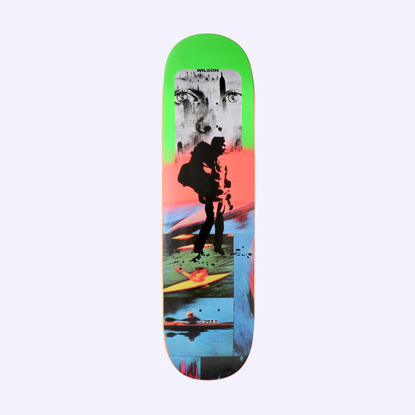 Quasi Wilson Urbex skateboard deck: A collage on bands of neon green, coral and blue: a black and white close-up of eyes over a city skyline, a black silhouette of a figure with a backpack, and photos of kayakers below.