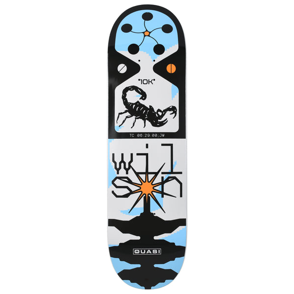 Quasi Wilson Y2K skateboard deck: Black, white and pale blue deck with a scorpion in a framed panel with a 10K label and timecode, a button cluster at the nose, and rider name in angular pixel lettering above an orange starburst. Quasi logo at the tail.