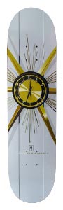 Girl Mccrank Interiors skateboard deck: A clock face with a gold and black dial and gold radiating rays and thin lines, on a pale grey deck with vertical panel lines. A small Girl logo and rider name sit below.