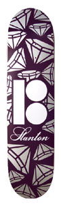 Plan B Repeat Stanton skateboard deck: Dark purple deck covered in an all-over pattern of outlined silver diamonds and gems. A white Plan B logo sits in the centre with a script 'Stanton' signature beneath it.