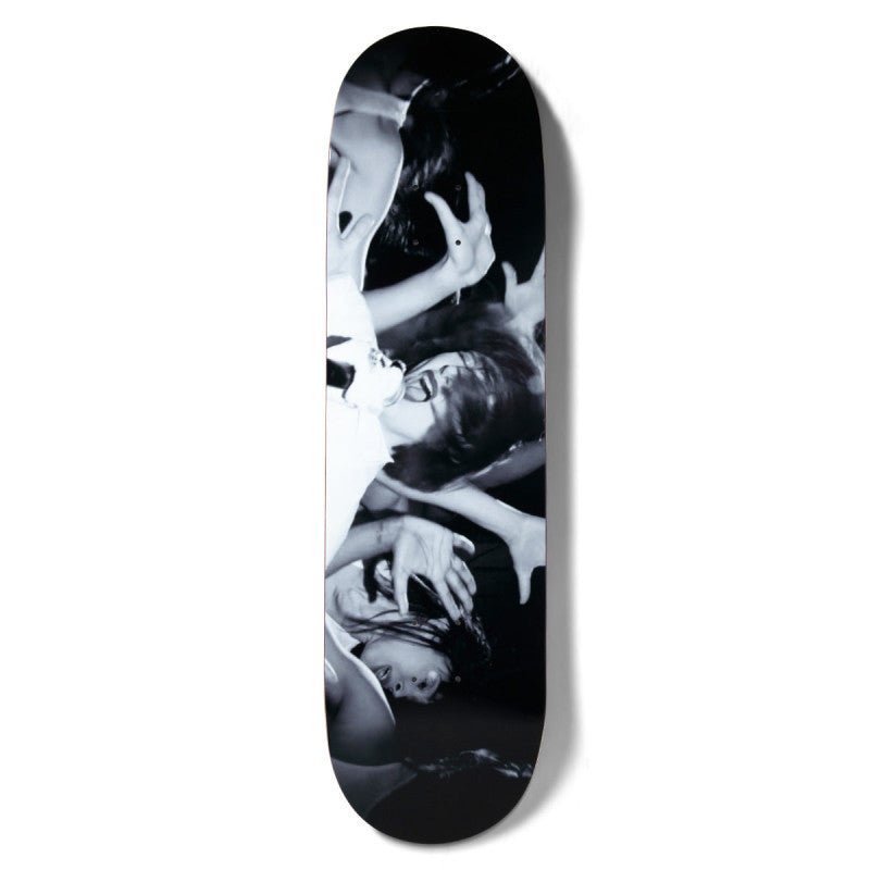Girl Spike Photo Series V2 Karen O skateboard deck: A black-and-white live-music photograph, turned sideways along the deck, of a singer with dark hair screaming into a microphone while a crowd's hands reach towards her.