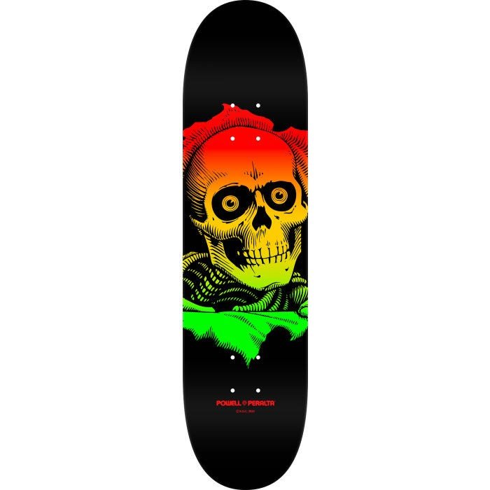 Powell Peralta Ripper Rasta Fade 249 skateboard deck: A skull with large round eyes bursts from a torn hole above skeletal ribs, filled with a fade from red through orange and yellow to green, on a black deck.
