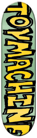 Toy Machine Scribble skateboard deck: Large, scribbled yellow Toy Machine lettering with a thick black outline, running down the length of a pale green deck. The letters are rough and hand-drawn, and cropped at the tail.