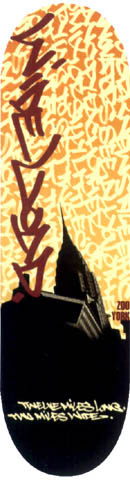 Zoo York Zoo York Wideload skateboard deck: Orange background filled with graffiti-style tags, with a large red-brown graffiti tag down the board over a black silhouette of a New York skyscraper at the base. A line of yellow handwritten text runs along the bottom with a small Zoo York mark.