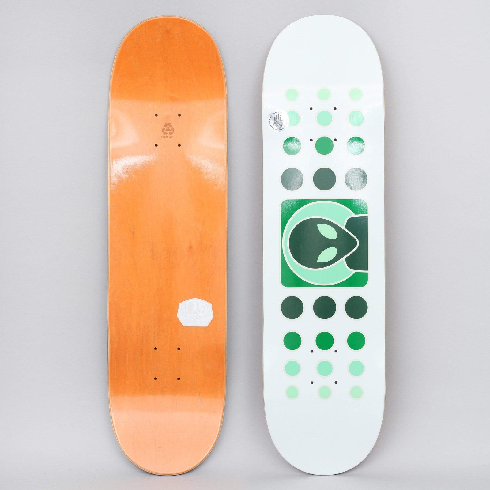 Alien Workshop Dot Fade White / Green skateboard deck: White deck with a green square holding a dark alien head logo, flanked above and below by rows of dots fading from pale mint to dark green. Orange underside shown beside it.