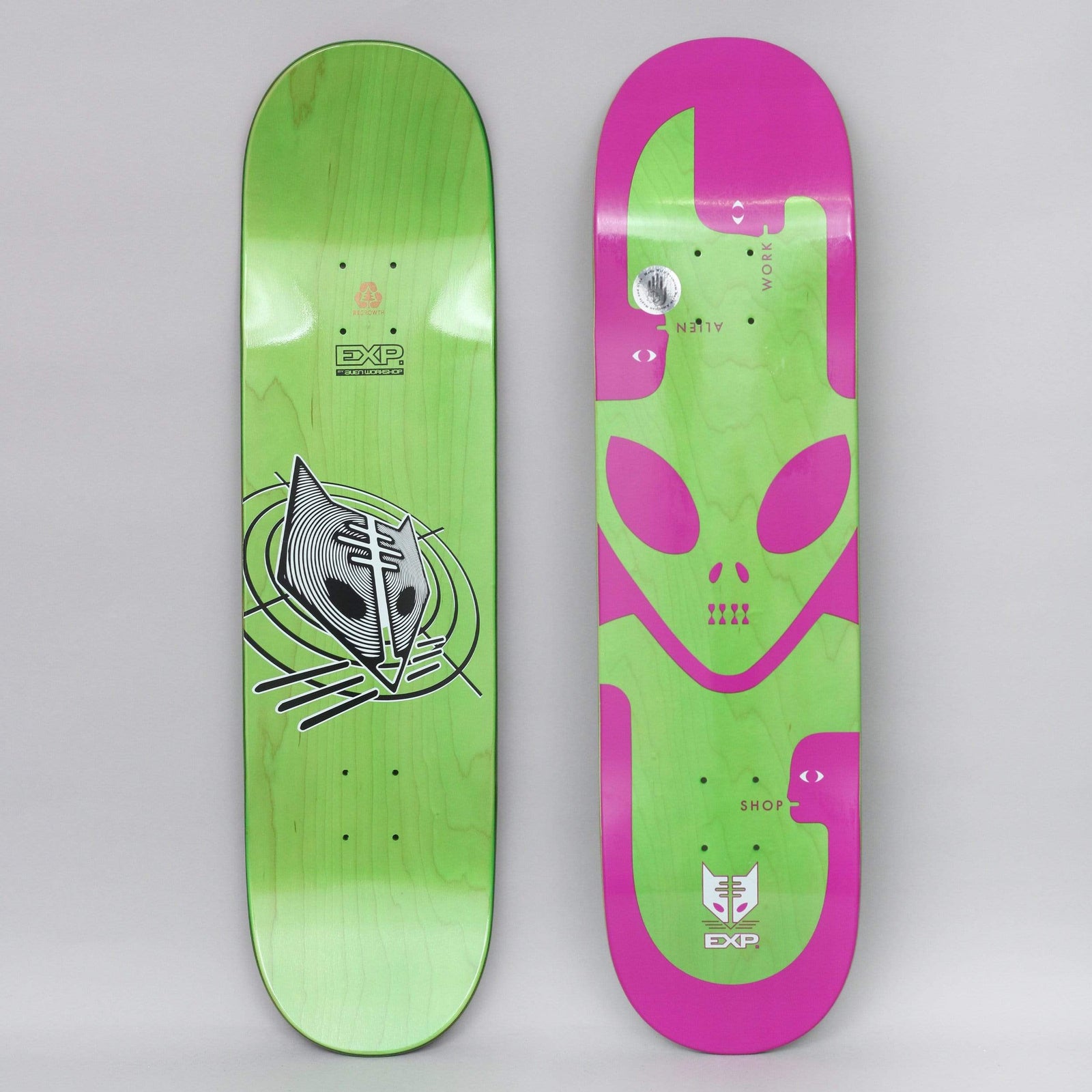 Alien Workshop Exp Purple skateboard deck: Pink deck with a large green alien head and abstract green figure shapes, with ALIEN WORKSHOP lettered along the sides. The green underside shows a black and white cat-like alien mask in concentric lines with the EXP logo.