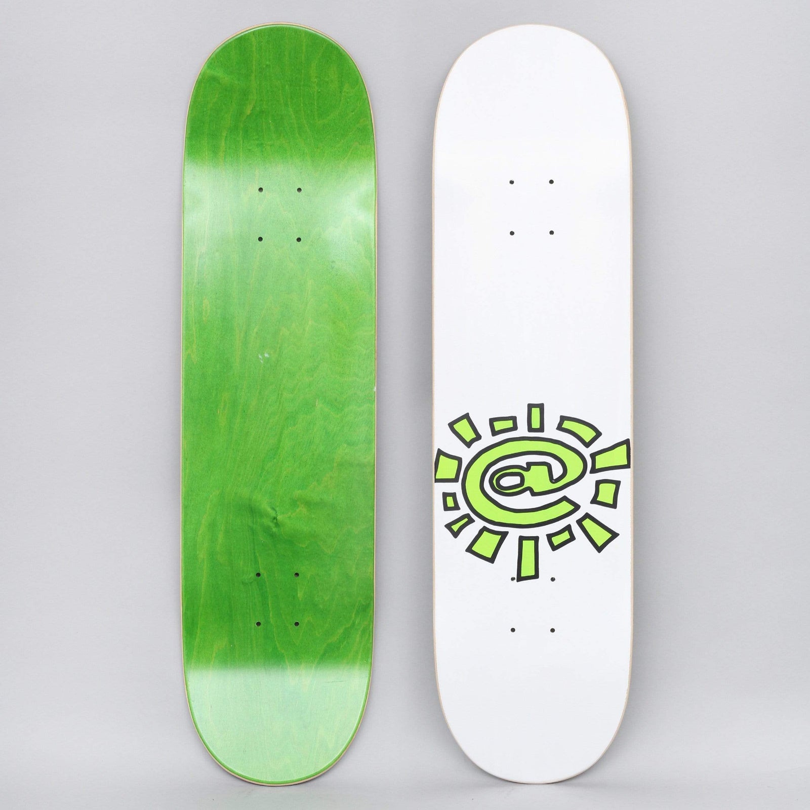 Always @Sun White skateboard deck: Both sides shown. A lime green sun with an at-sign in the centre and chunky outlined rays is printed low on a white deck. The underside is stained green.