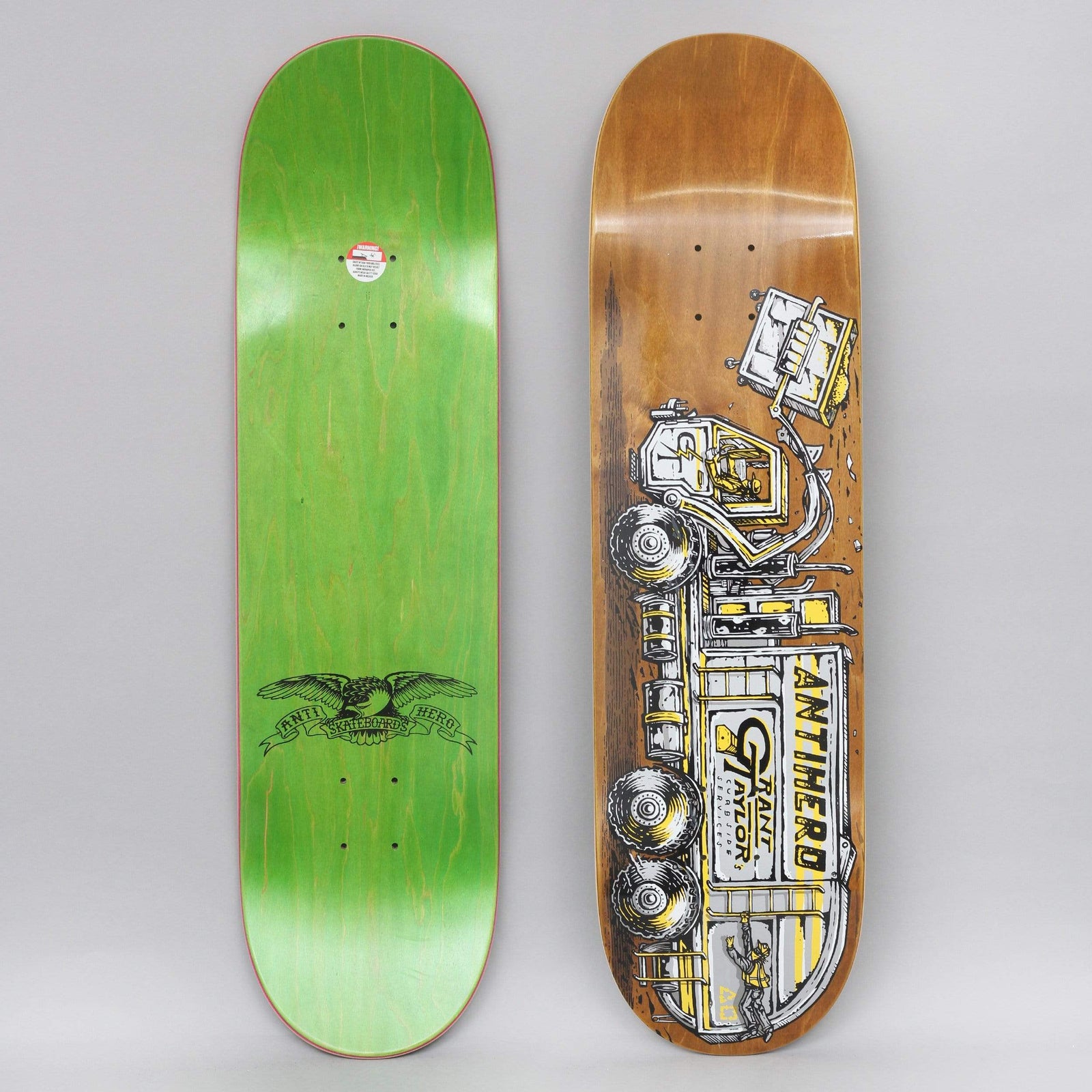 Anti Hero Taylor Curbside Service skateboard deck: A detailed illustration of a rubbish truck lifting and tipping a bin, with workers at the side, printed in yellow, white and black over a brown stained deck. The bottom shows a green stain with the Anti Hero eagle.