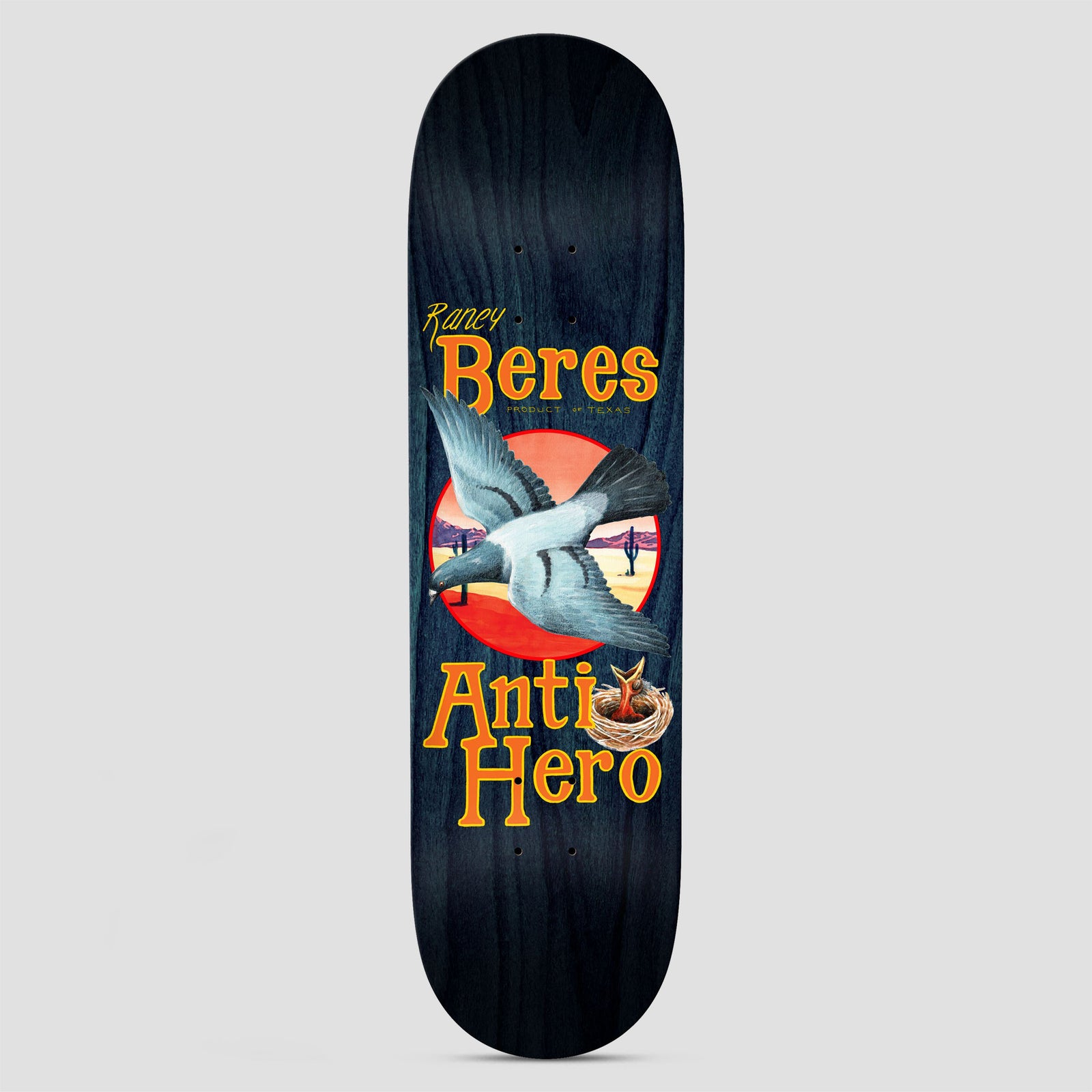 Anti Hero Raney Homers skateboard deck: Painted pigeon flying across a red sun and desert landscape with cacti, above a nest with a chick, on a navy-stained deck. Raney Beres in orange lettering at the top and Anti Hero at the bottom.