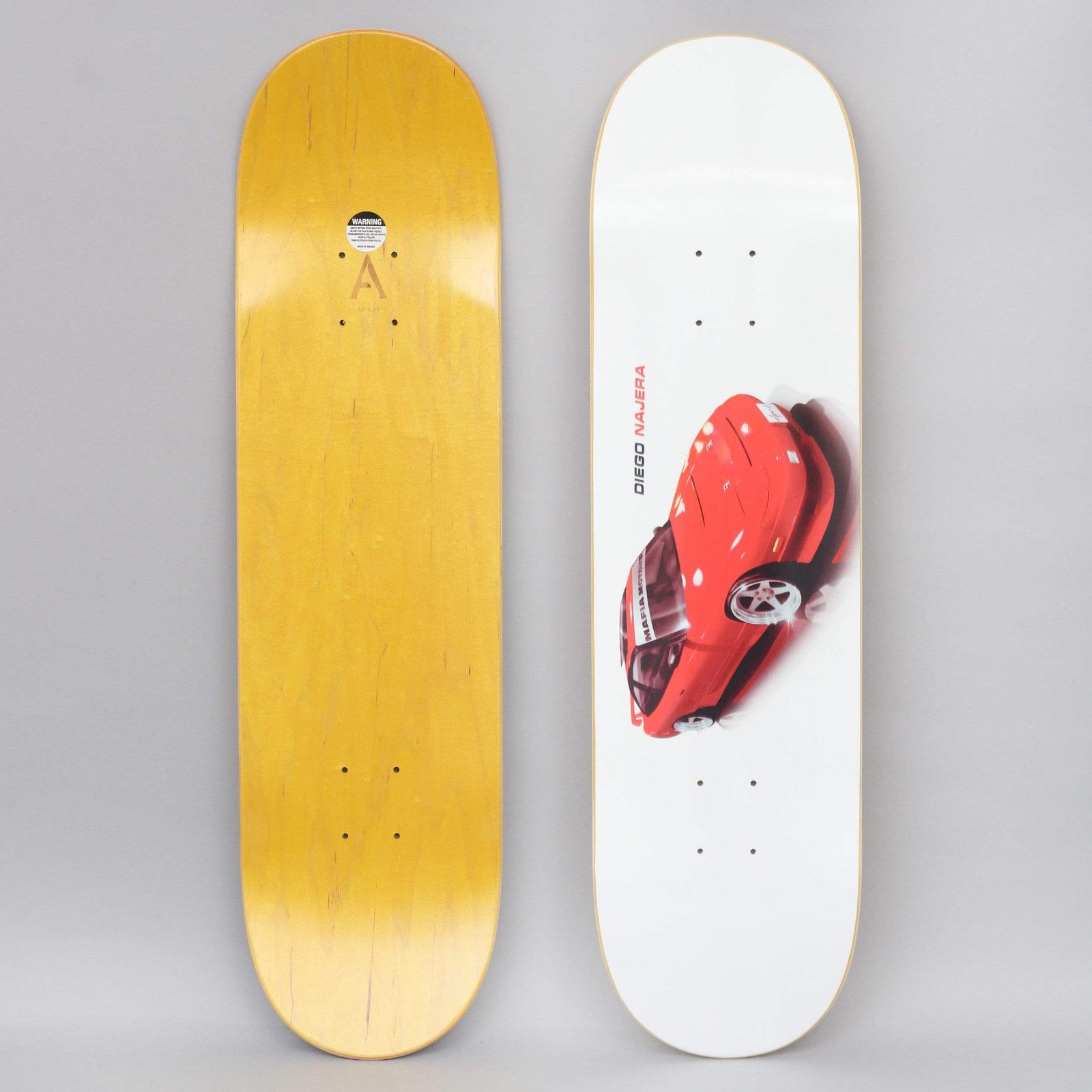 April Diego 240 White skateboard deck: Both sides shown. A glossy red sports car seen from above at an angle, with a blurred motion shadow, on a white deck, with the rider's name printed vertically beside it. The underside is plain yellow wood.