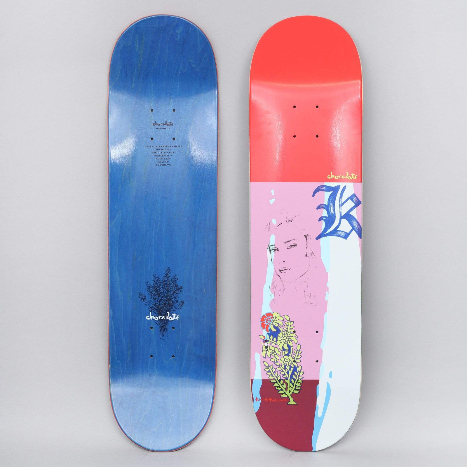 Chocolate Kenny Anderson Muse skateboard deck: Colour-blocked deck with a red top, a pink panel carrying a line drawing of a woman's face and a blue gothic letter K, a white strip and a maroon base with a yellow and green flower sprig. The photo also shows the blue stained underside.