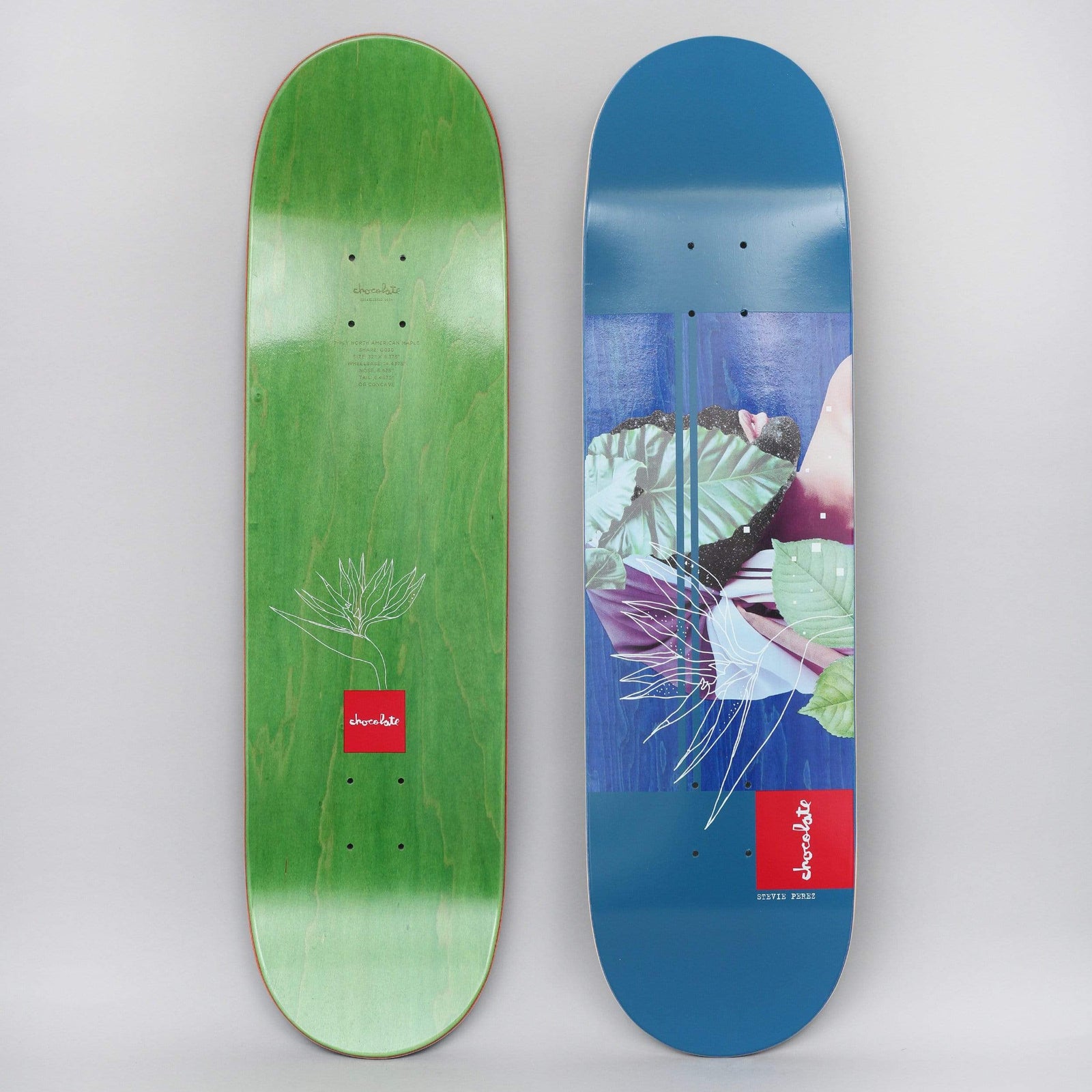 Chocolate Stevie Perez Devine Sublime Navy skateboard deck: Collage of green tropical leaves, a purple-toned figure and a white line-drawn bird of paradise flower over blue panels with thin stripes, with a red Chocolate logo block and rider name at the bottom.