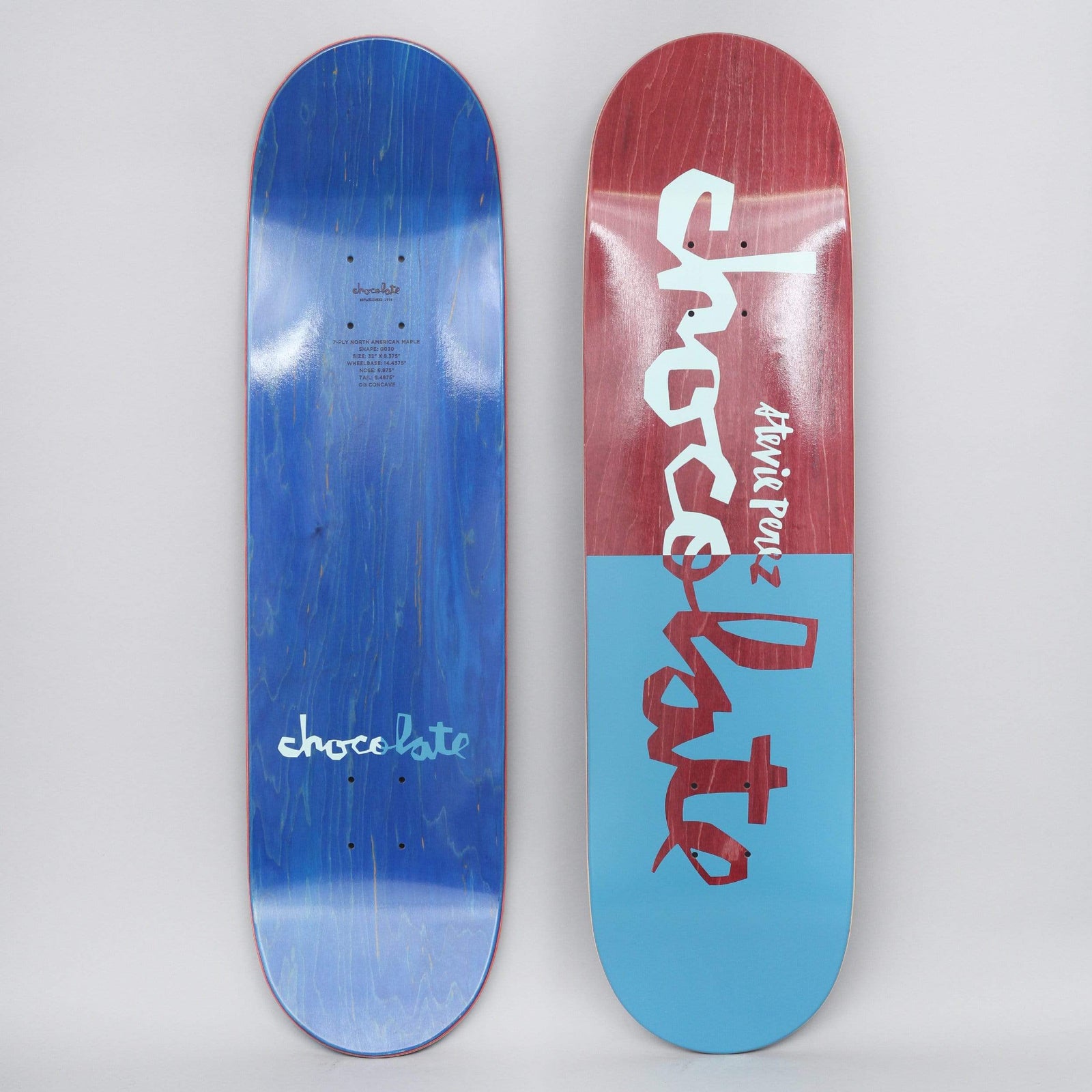 Chocolate Stevie Perez Original Chunk Red / Navy skateboard deck: Deck split in two halves, red-stained at the top and light blue below, with the Chocolate chunk logo in large hand-cut lettering that changes colour across the split. 'Stevie Perez' written in small script beside it.